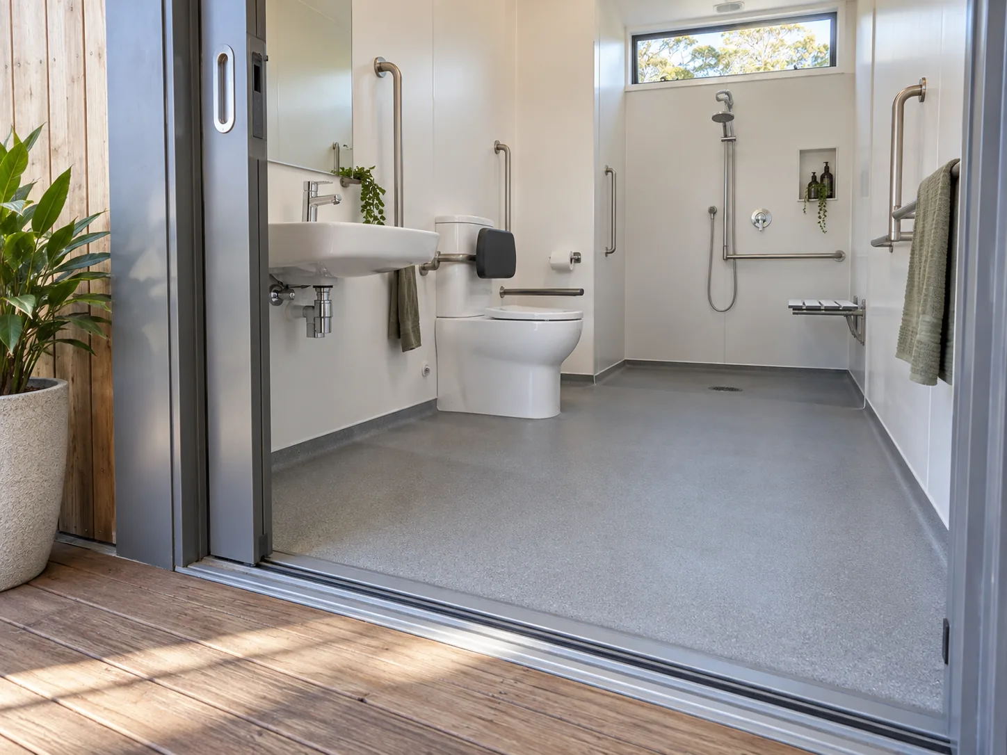Level entry from a timber deck into an accessible bathroom module