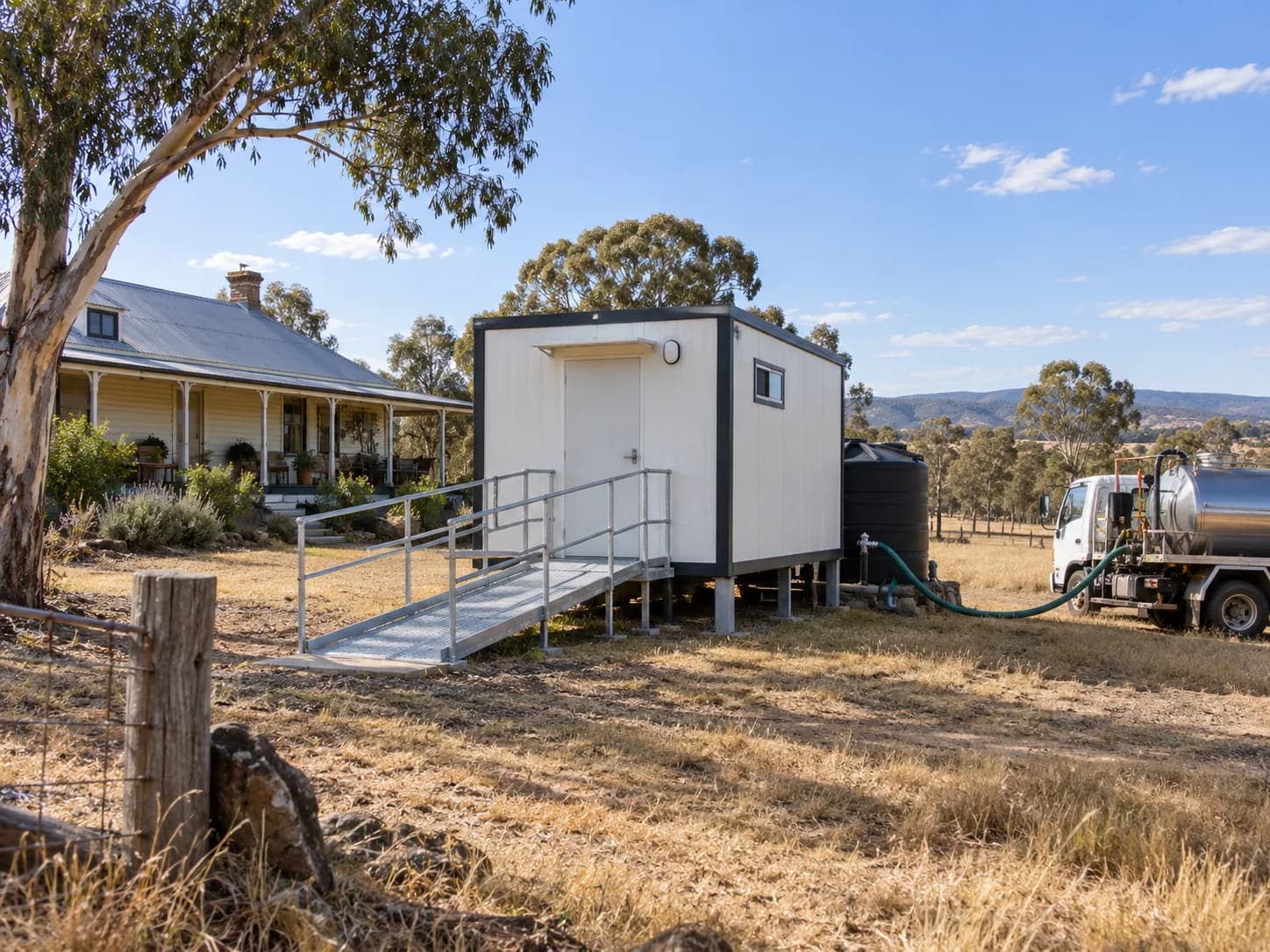 Accessible bathroom module on a rural property with holding tank and pump-out truck